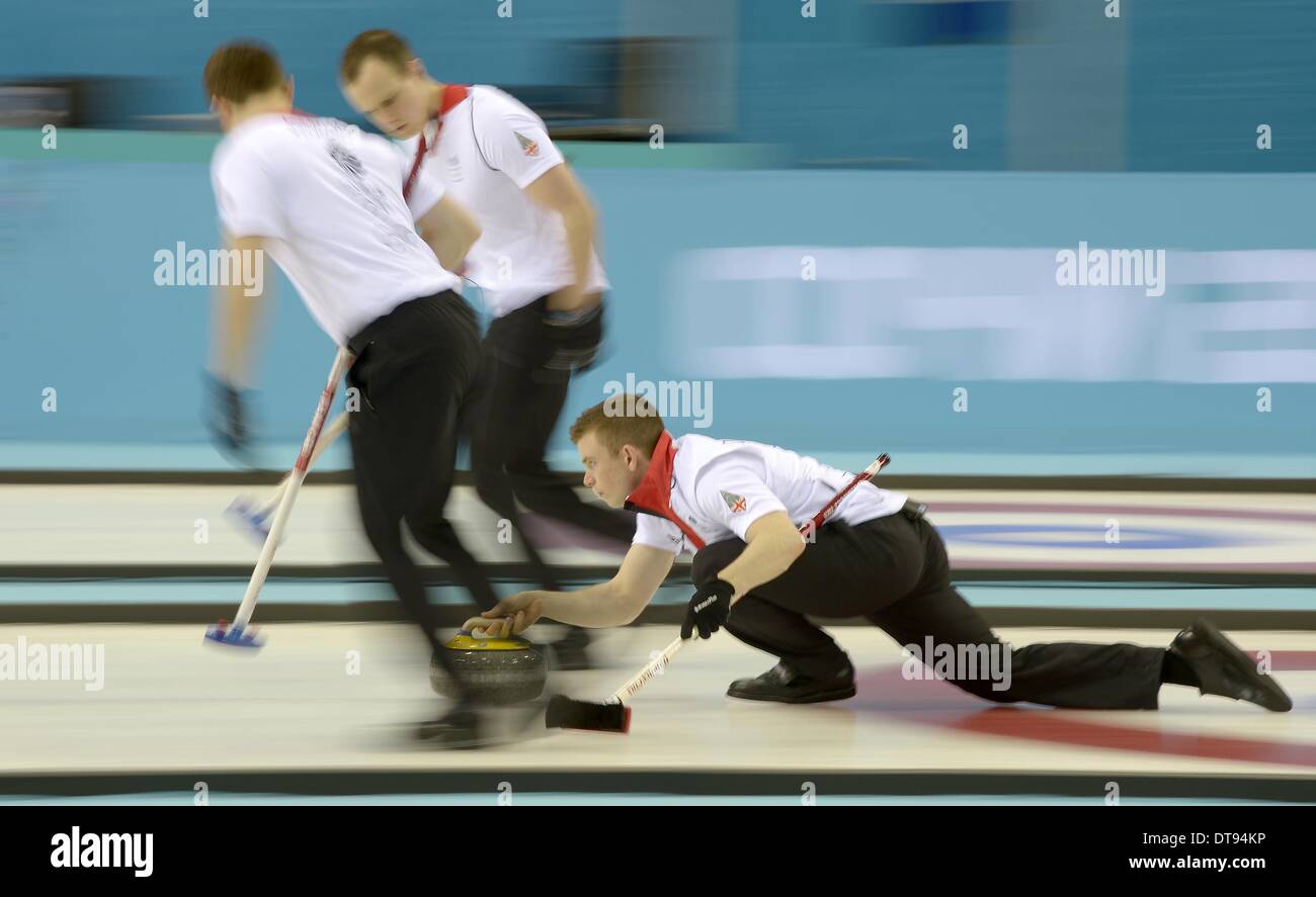 Greg Drummond (GBR, vice skip) with Scott Andrews (GBR, left) and Michael Goodfellow (GBR). Mens curling - Ice Cube Curling Centre - Olympic Park - Sochi - Russia - 12/02/2014 Stock Photo