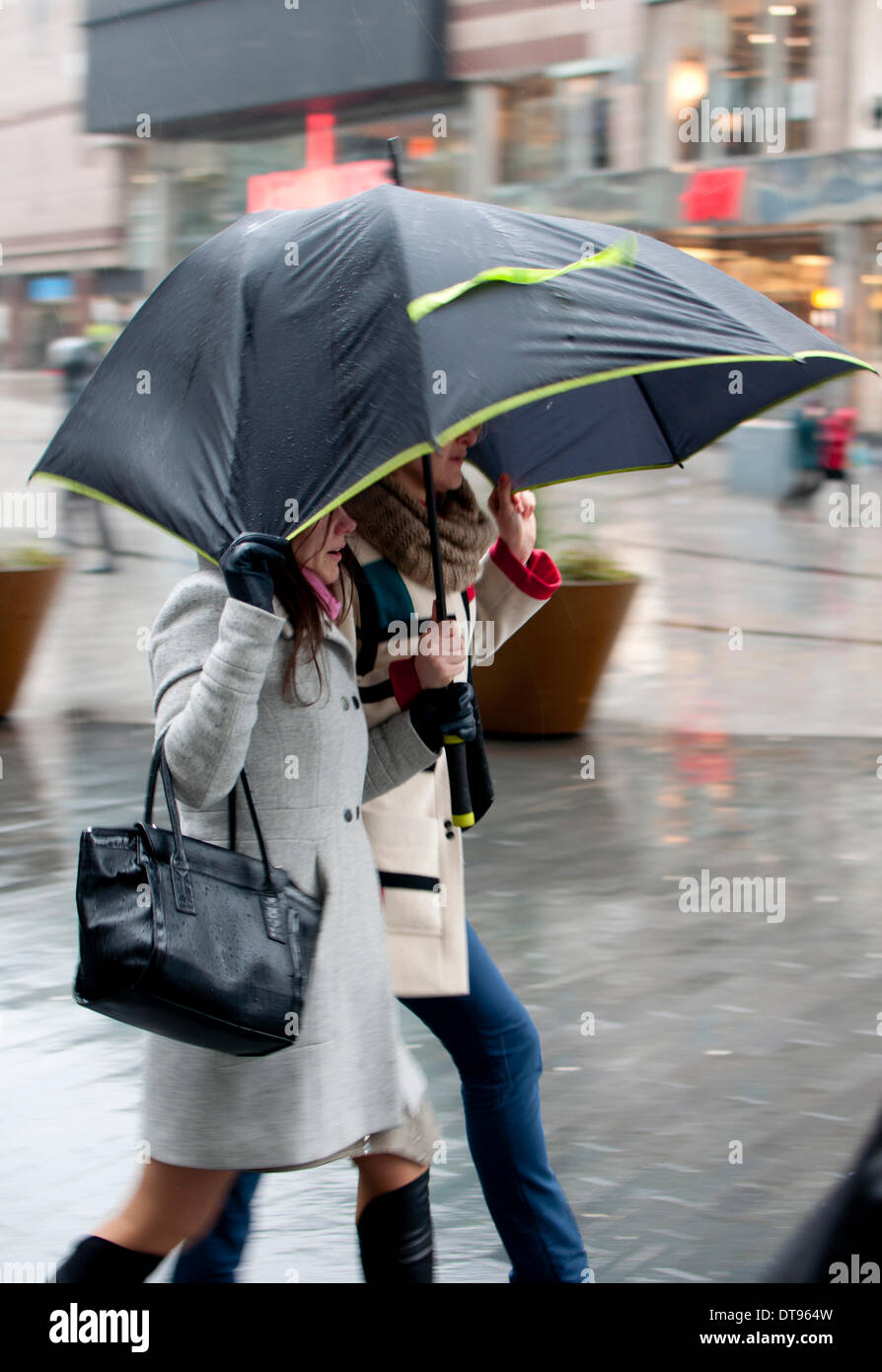 Birmingham, West Midlands, England, UK.12th Feb, 2014. Two women share