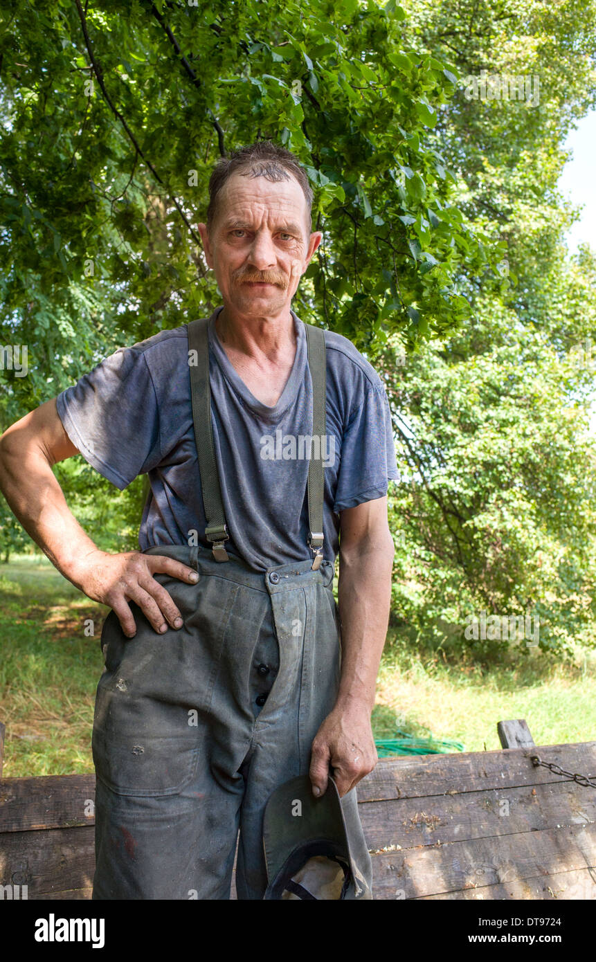 Polish farmer age 48 dressed in his work clothes. Zawady Central Poland Stock Photo