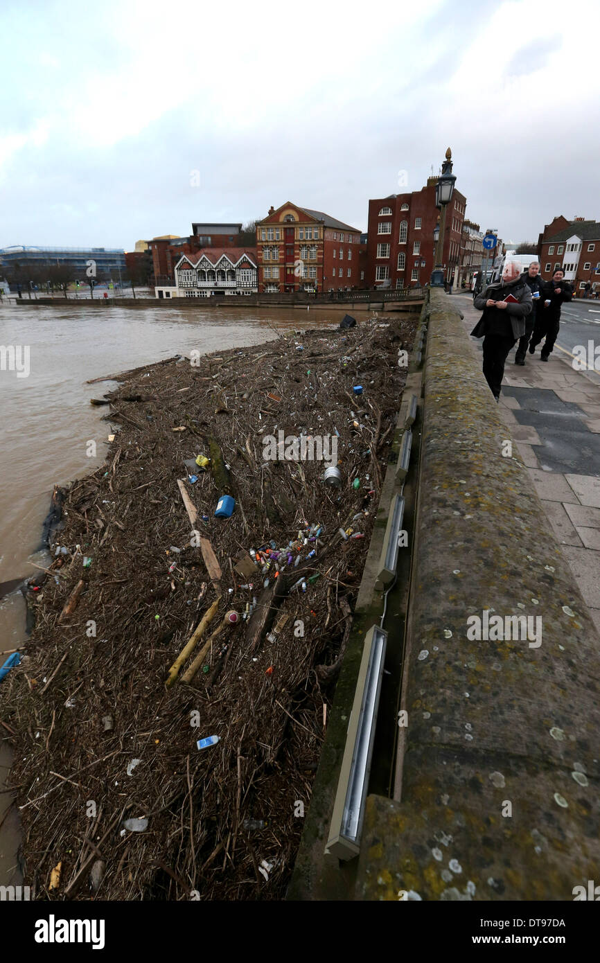 Worcester, UK. 12th Feb, 2014. Huge amounts of debris block the arches of the bridge over the river Severn in Worcester, adding to concerns that the town will flood as the water levels , the highest ever seen, continue to rise and threaten the town. Flood water in Worcestershire could spill over barriers for the first time ever, the Environment Agency has warned. The river is due to peak on Thursday at 5.8m, with the flood defences built to withstand levels of 5.7m (18ft 8in). Credit:  Joanne Roberts/Alamy Live News Stock Photo