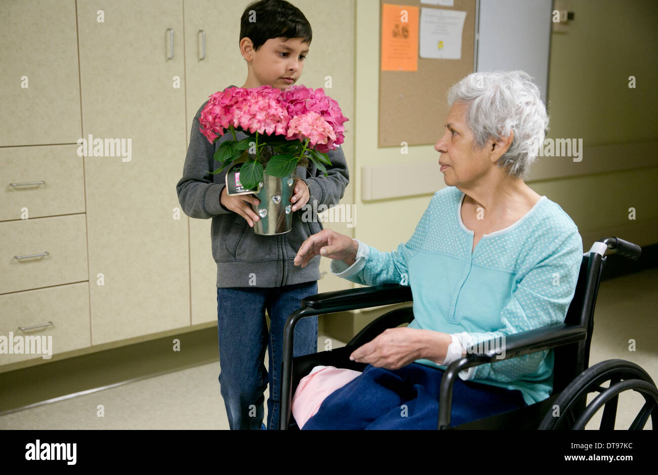Grandson Gives His Elderly Hispanic Grandmother In A Wheelchair A