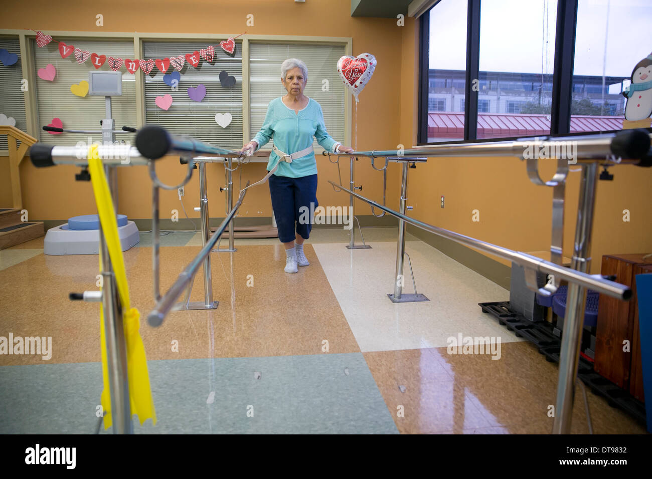 female Hispanic senior citizen does physical therapy exercise while in