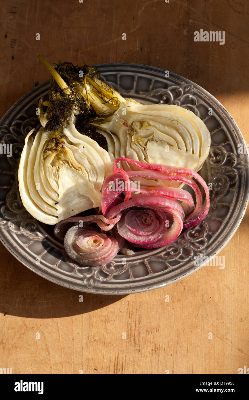 plate of roasted veggies  fennel and red onion Stock Photo