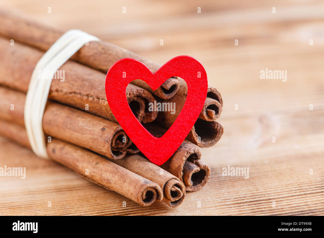 Cinnamon sticks with heart Stock Photo Alamy