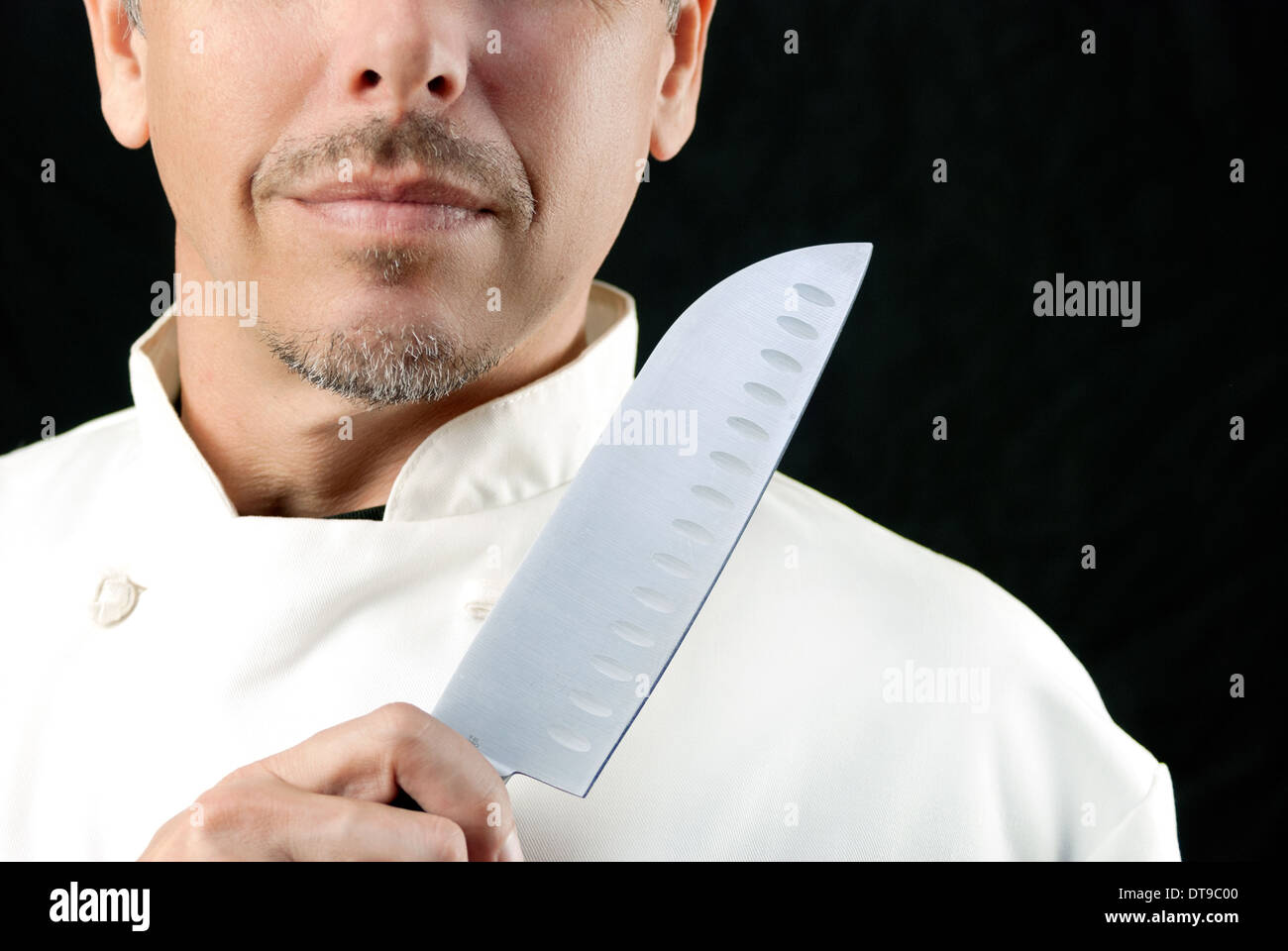 Close-up of a chef displaying his knife. Stock Photo