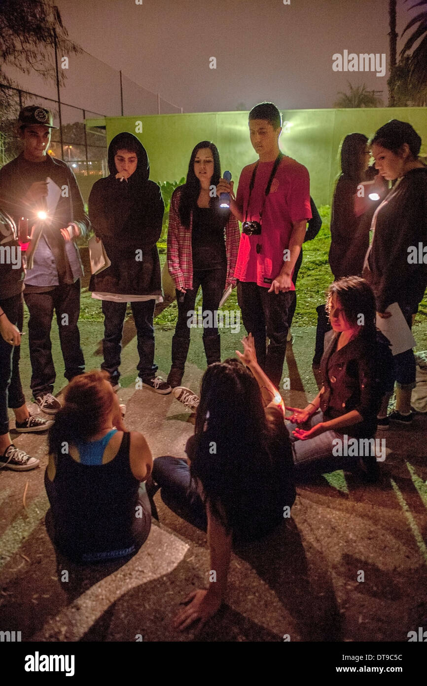 A Regional Occupation Program (ROP) students question classmates posing as crime victims in a crime scene investigation outdoor Stock Photo