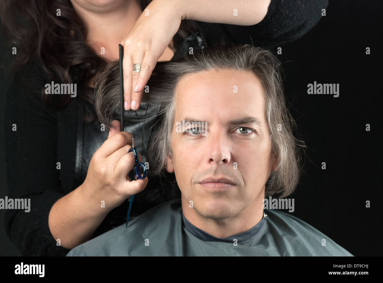 Man Getting Long Hair Cut Off For Cancer Fundraiser Stock Photo