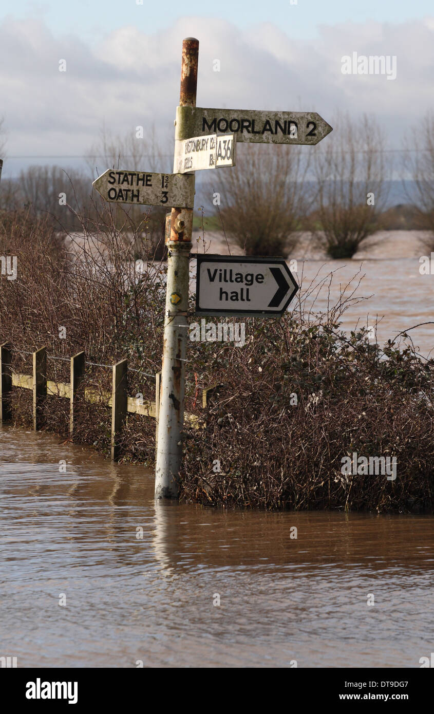 Moorlands village sign post on the flooded A361 on the Somerset Levels