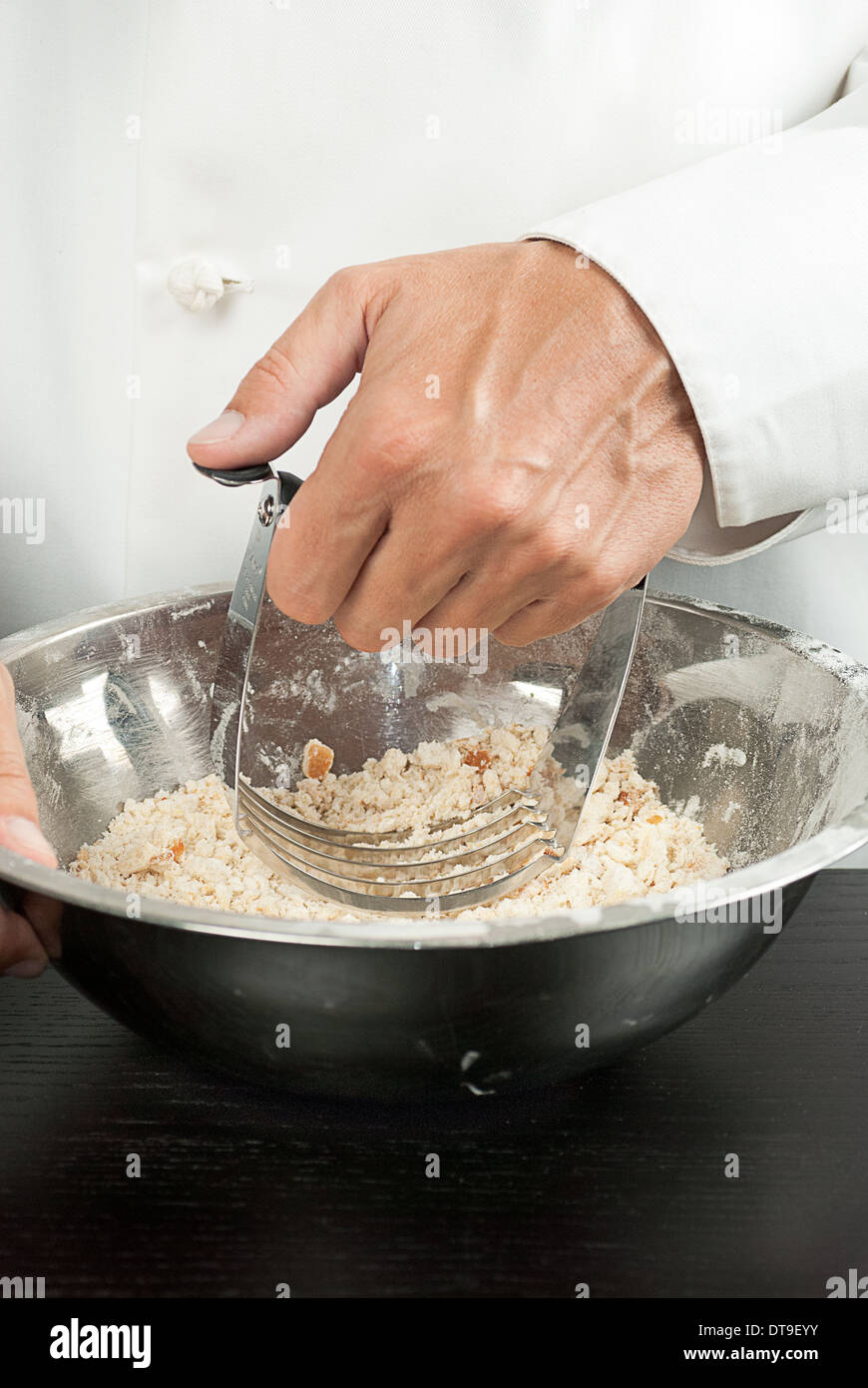 Close-up of a pastry chef preparing a crust Stock Photo