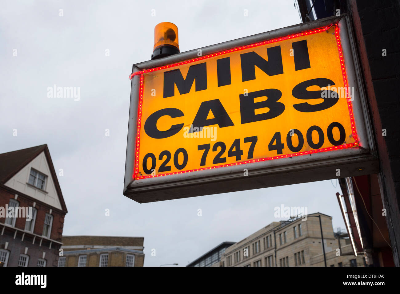 Mini cabs flashing orange light and sign, London, UK Stock Photo