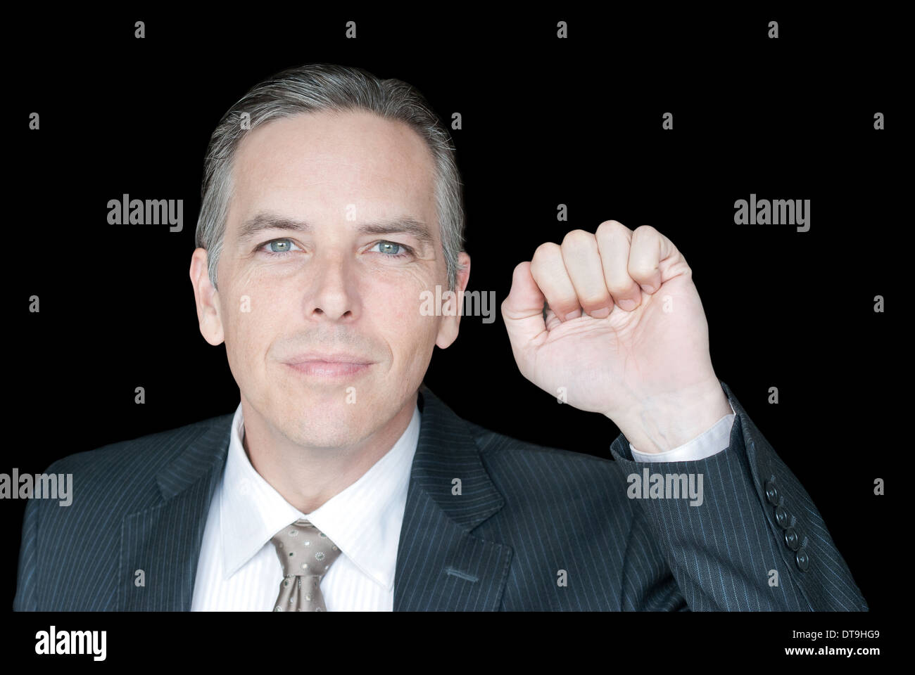 Close-up of a businessman knocking on the fourth wall, chest up. Stock Photo