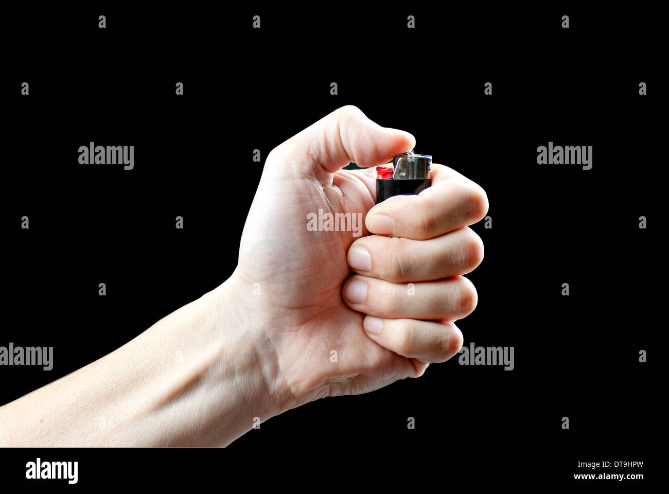 Close-up of a man's hand about to light a lighter. Stock Photo