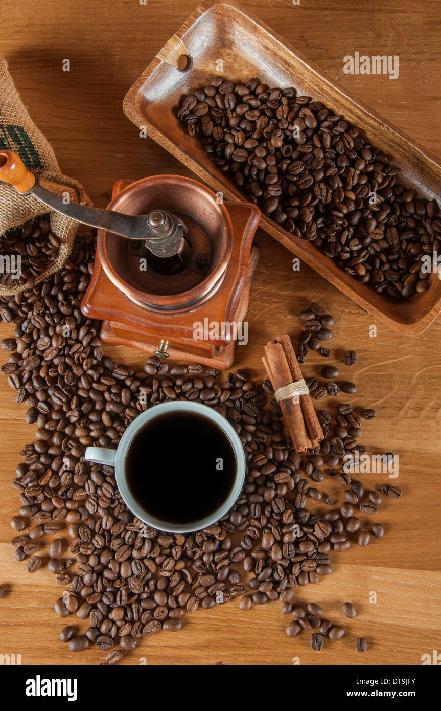 Coffee theme with wooden table and dark background Stock Photo - Alamy