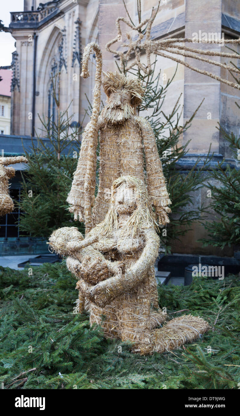 Unusual Christmas nativity scene with straw figures of Baby Jesus