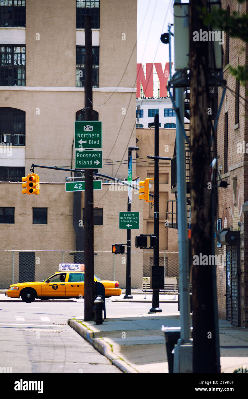 View Street in New York City. Yellow taxi drives through the town. Stock Photo