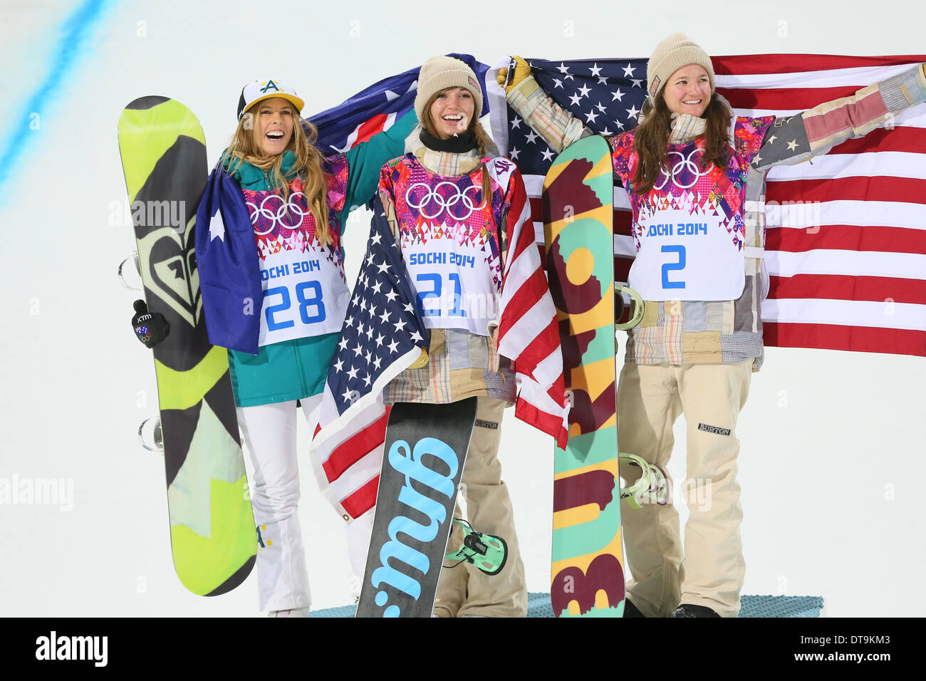 Torah Bright (AUS) celebrates with Kaitlyn Farrington (USA) and Kelly Clark (USA) at the flower ceremony for the women's halfpipe at the Sochi 2014 Winter Olympic Games. Australian Bright won the silver medal with Americans Farrington taking gold and Clark bronze. (Photo Yutaka/AFLO) medallist Kelly Clark (left) and gold medallist Kaitlyn Farrington, both from the US. Stock Photo