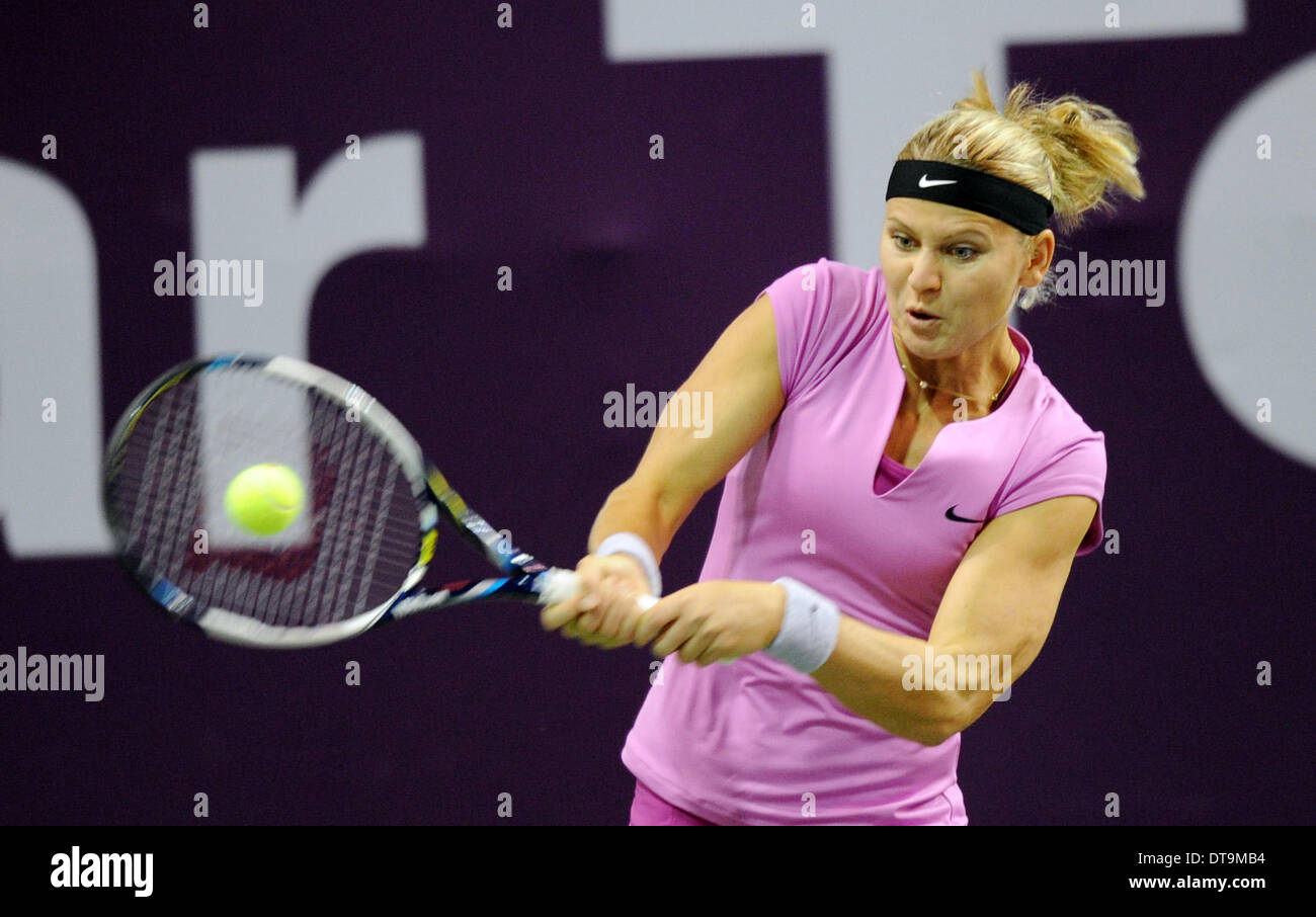 Doha. 12th Feb, 2014. Lucie Safarova of Czech Republic hits a return against Peng Shuai of China at the Qatar Open tennis tournament in Doha, Qatar on Feb. 12, 2014. Peng Shuai lost 1-2. Credit:  Chen Shaojin/Xinhua/Alamy Live News Stock Photo