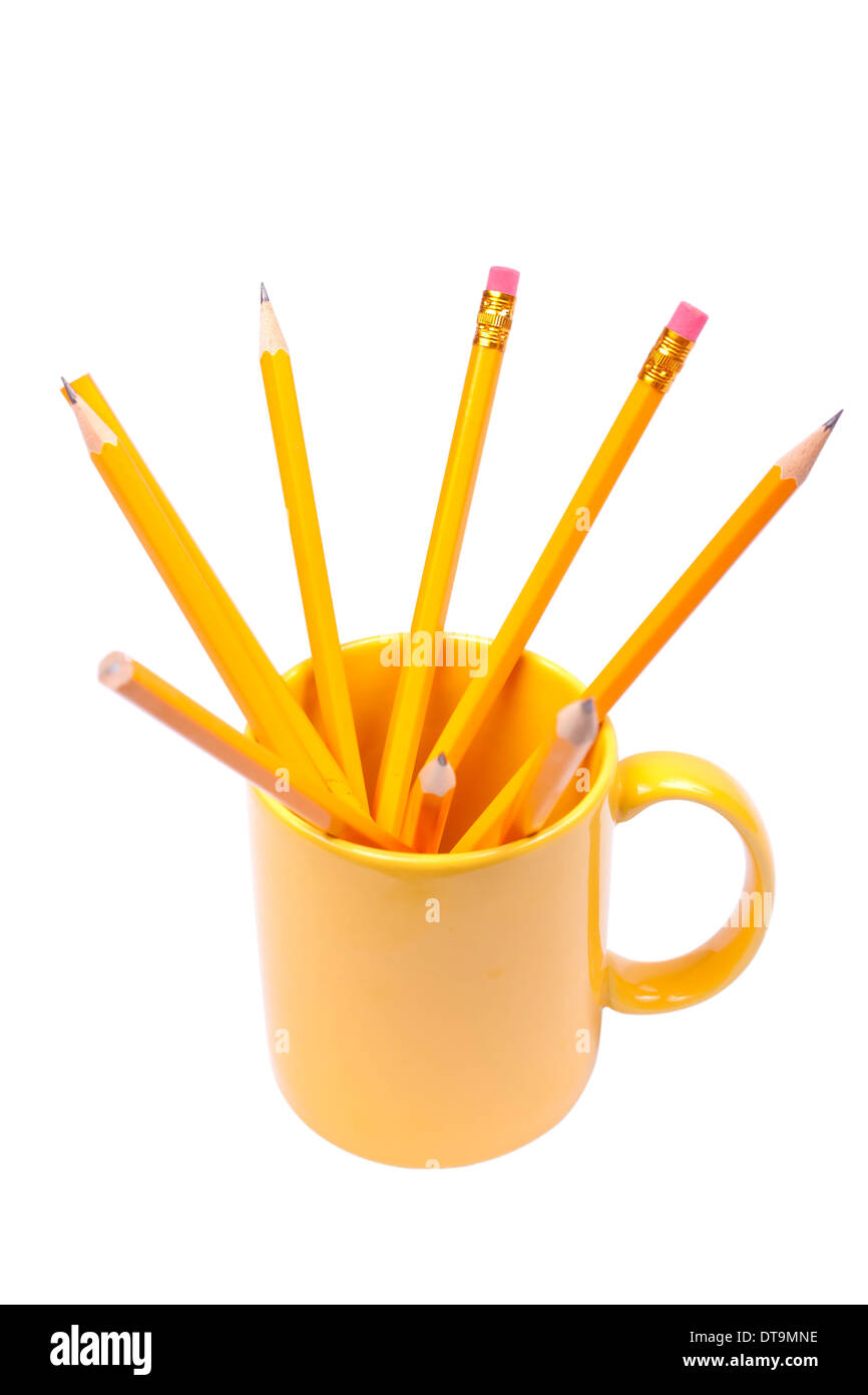 Pencils in a yellow cup isolated on white background Stock Photo
