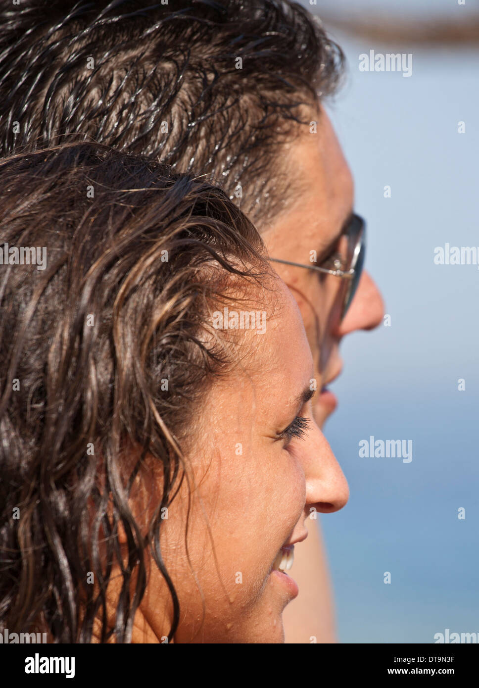Shallow focus image of a wet young couple on vacation Stock Photo
