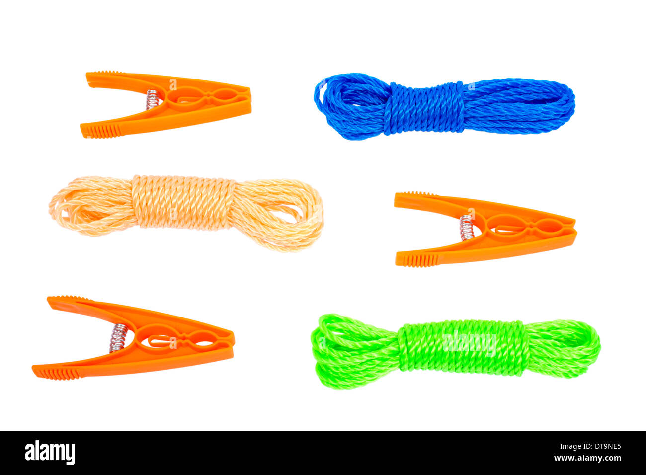 Three orange pegs and three laundry rope in different colors isolated on white background Stock Photo