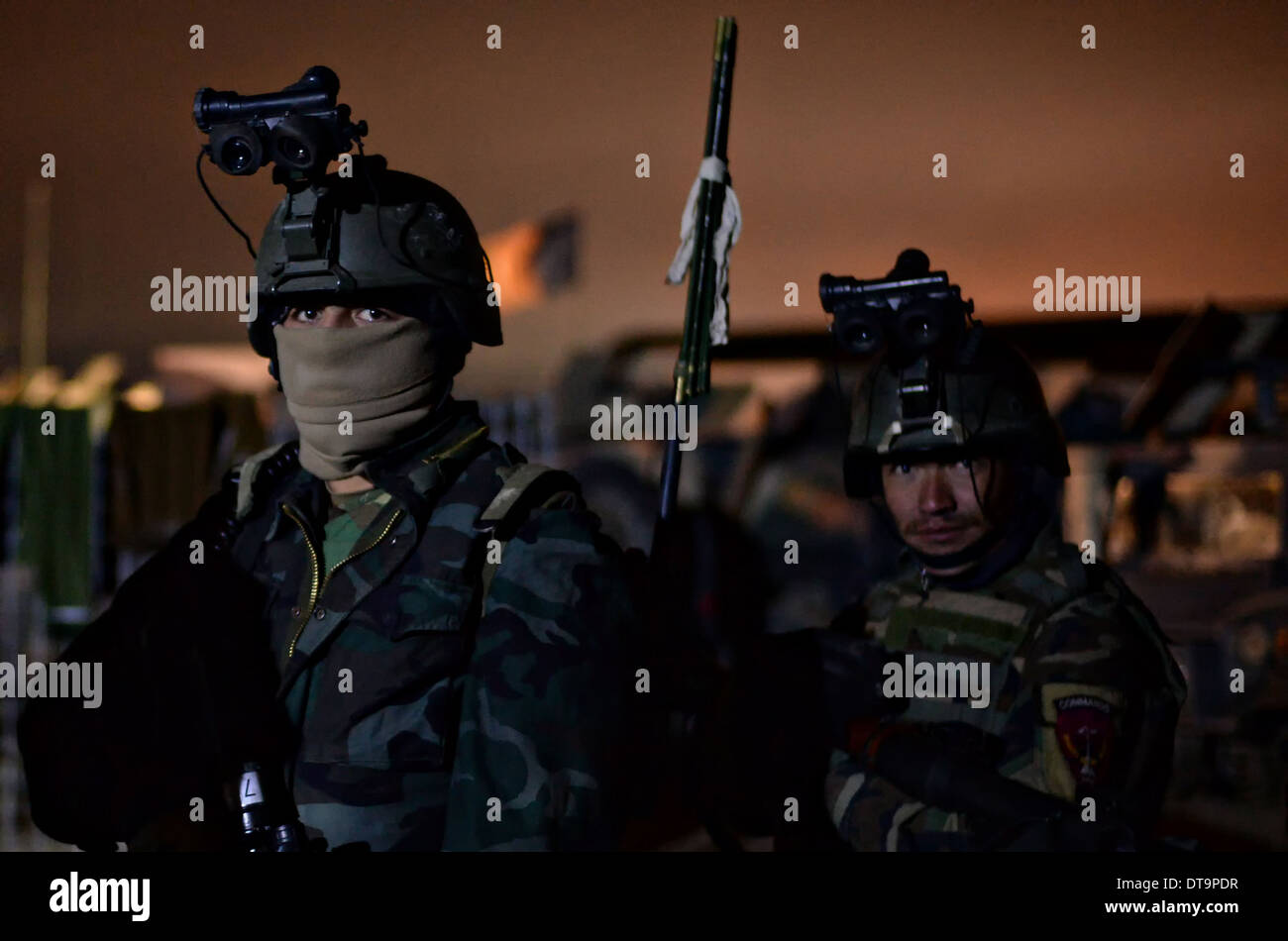 Afghan National Army commandos with the 7th Special Operations Kandak prepare for a mission Feb. 6, 2014 in the Washir district, Helmand province, Afghanistan. Stock Photo
