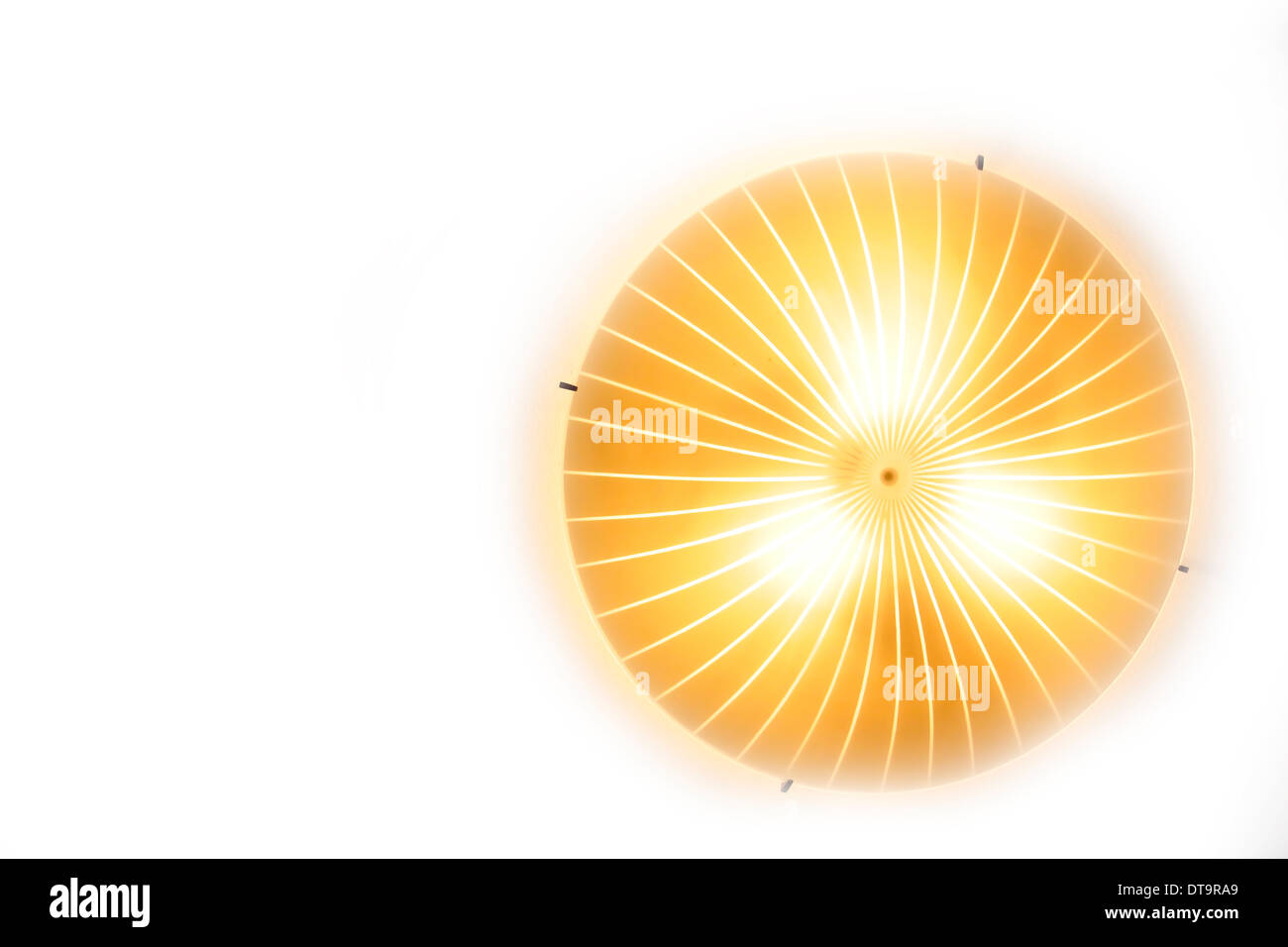 Yellow sun lamp against a white background as wallpaper Stock Photo Alamy