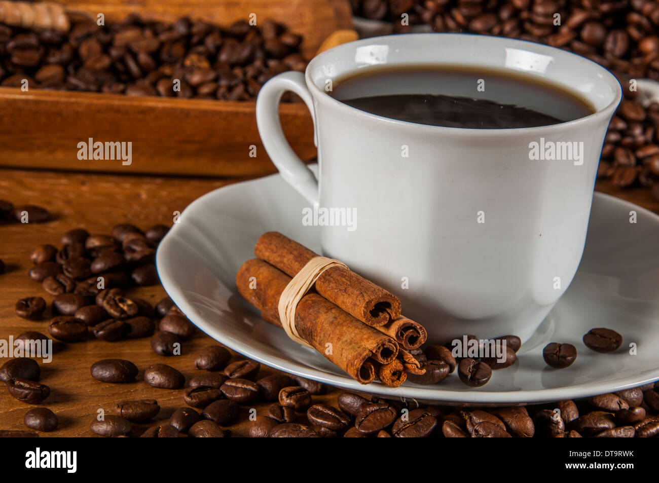 Coffee theme with wooden table and dark background Stock Photo - Alamy