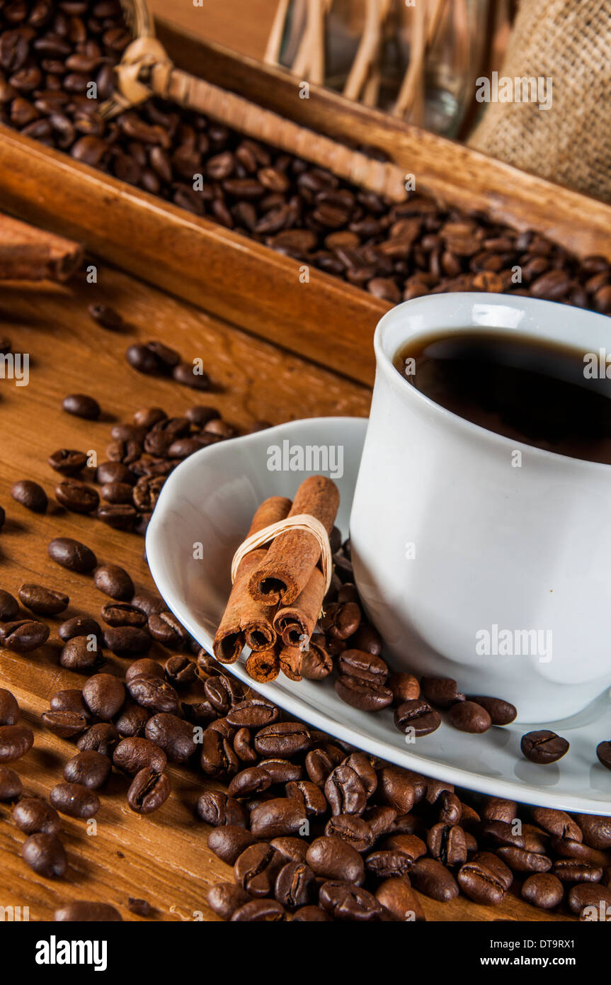 Coffee theme with wooden table and dark background Stock Photo - Alamy
