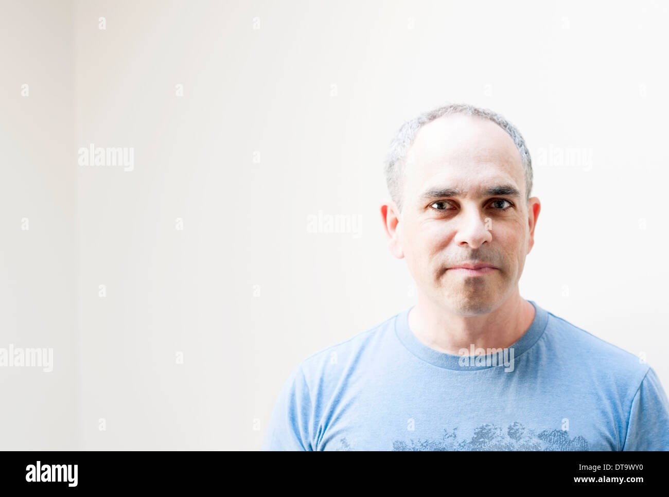 Middle aged baby boomer man on white background with copy space Stock Photo