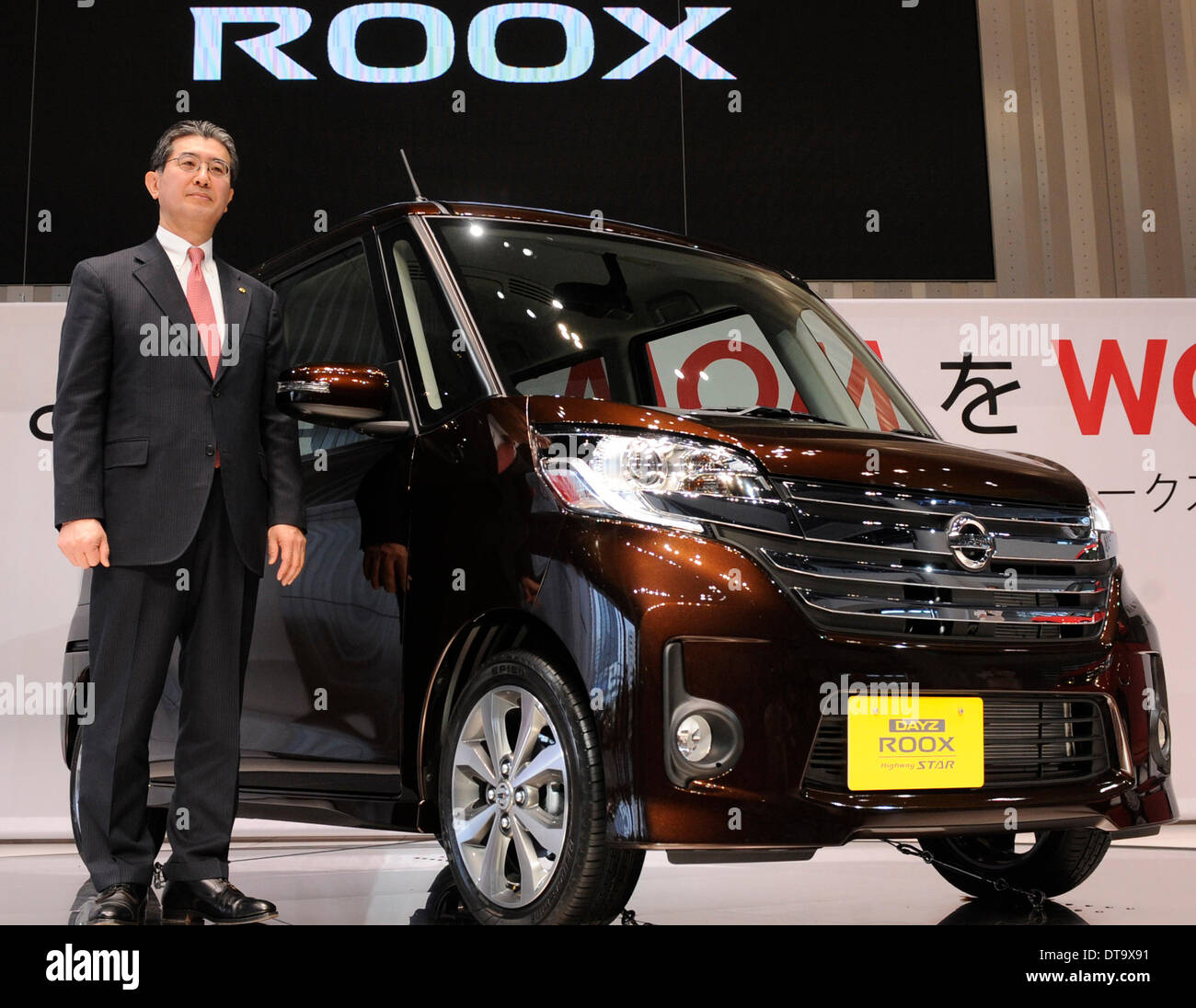 Yokohama, Japan. 13th Feb, 2014. Japan's auto giant Nissan's Vice President Takao Katagiri stands by Nissan's new model Dayz Roox at the headquarters of Nissan Motor in Yokohama, Japan, Feb. 13, 2014. Nissan's Dayz Roox was released on Thursday throughout Japan. © Stringer/Xinhua/Alamy Live News Stock Photo