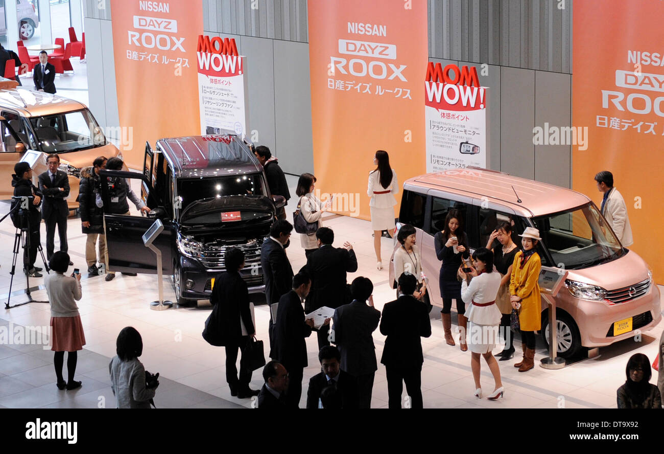 Yokohama, Japan. 13th Feb, 2014. People view Japan's auto giant Nissan's new model Dayz Roox at the headquarters of Nissan Motor in Yokohama, Japan, Feb. 13, 2014. Nissan's Dayz Roox was released on Thursday throughout Japan. © Stringer/Xinhua/Alamy Live News Stock Photo