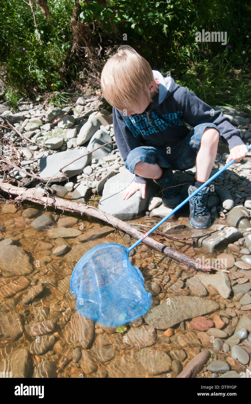 Boy fishing in river hi-res stock photography and images - Alamy