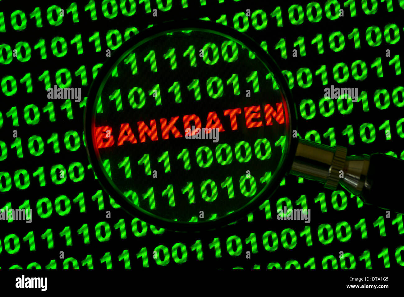 Binary code with the word 'Bankdaten', German for 'Banking Information' viewed through a magnifying glass Stock Photo