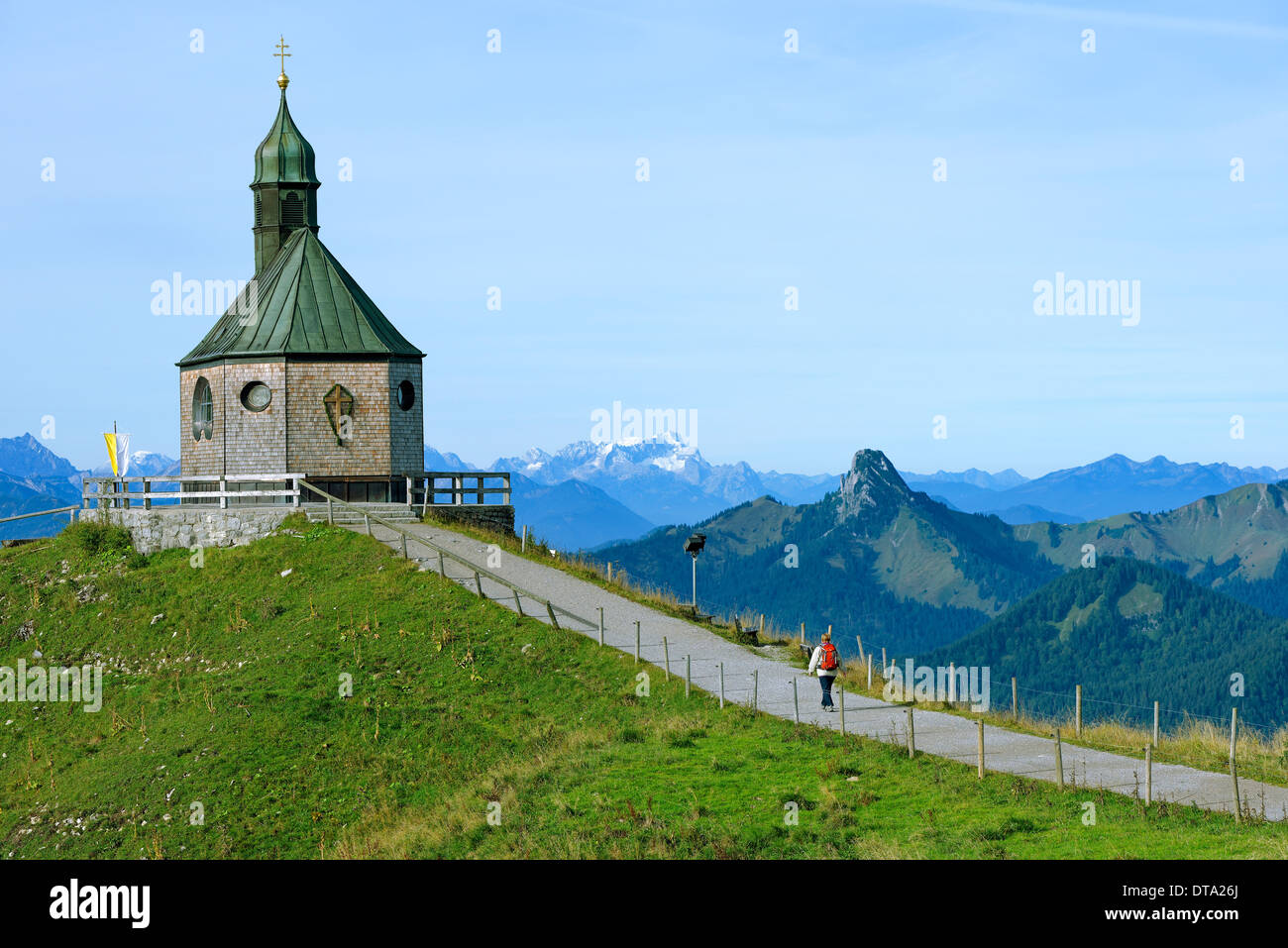 Heilige Kreuzerhöhung chapel, the mountains Leonhardstein, Wetterstein and Zugspitze at the back, Wallberg mountain Stock Photo