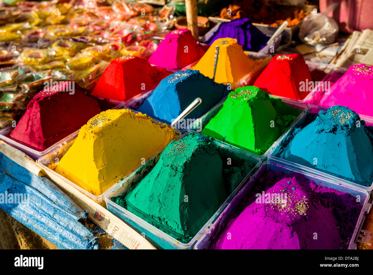 Colour powder in different colors is displayed in heaps for sale, Mumbai, Maharashtra, India Stock Photo