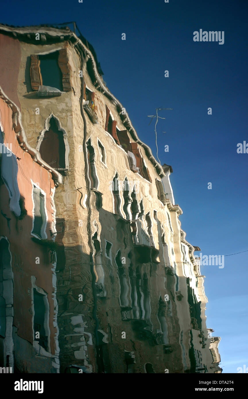 Reflection of a palazzo in a side canal, Venice, Veneto, Italy Stock Photo