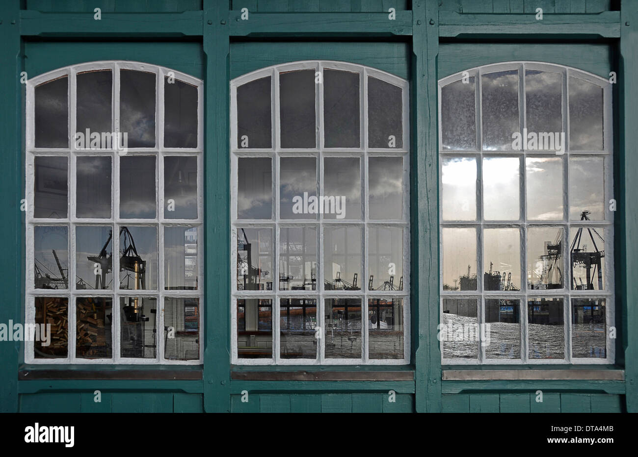 Reflection of a harbour scene in an old boat shed, Ovelgönne, Hamburg, Germany Stock Photo
