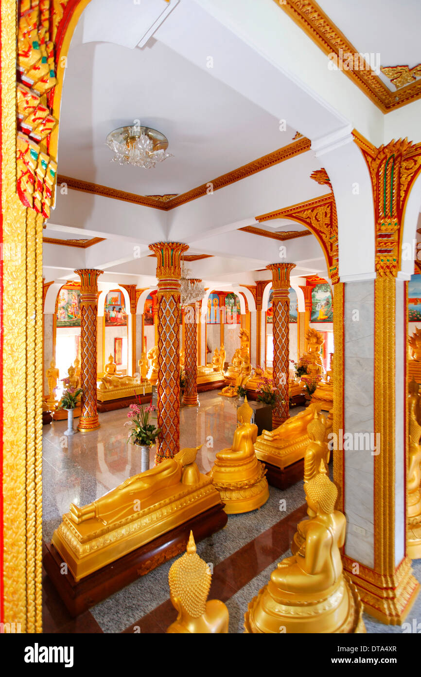 Room with golden Buddha statues, Wat Chalong temple, Phuket, Thailand Stock Photo
