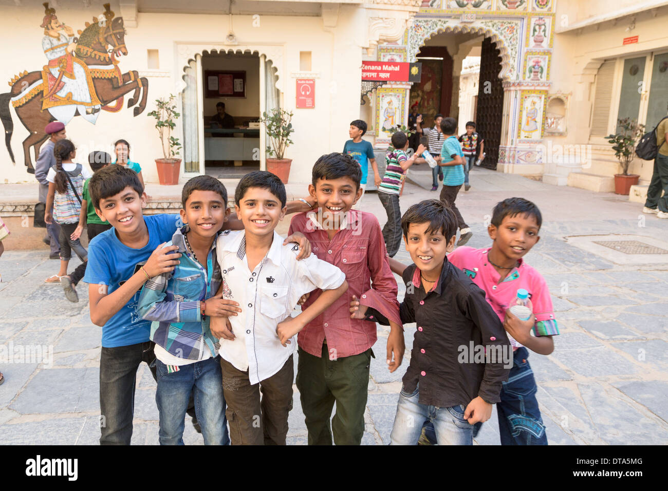 A group of children posing for the camera in Udaipur city Palace in Rajasthan, India Stock Photo