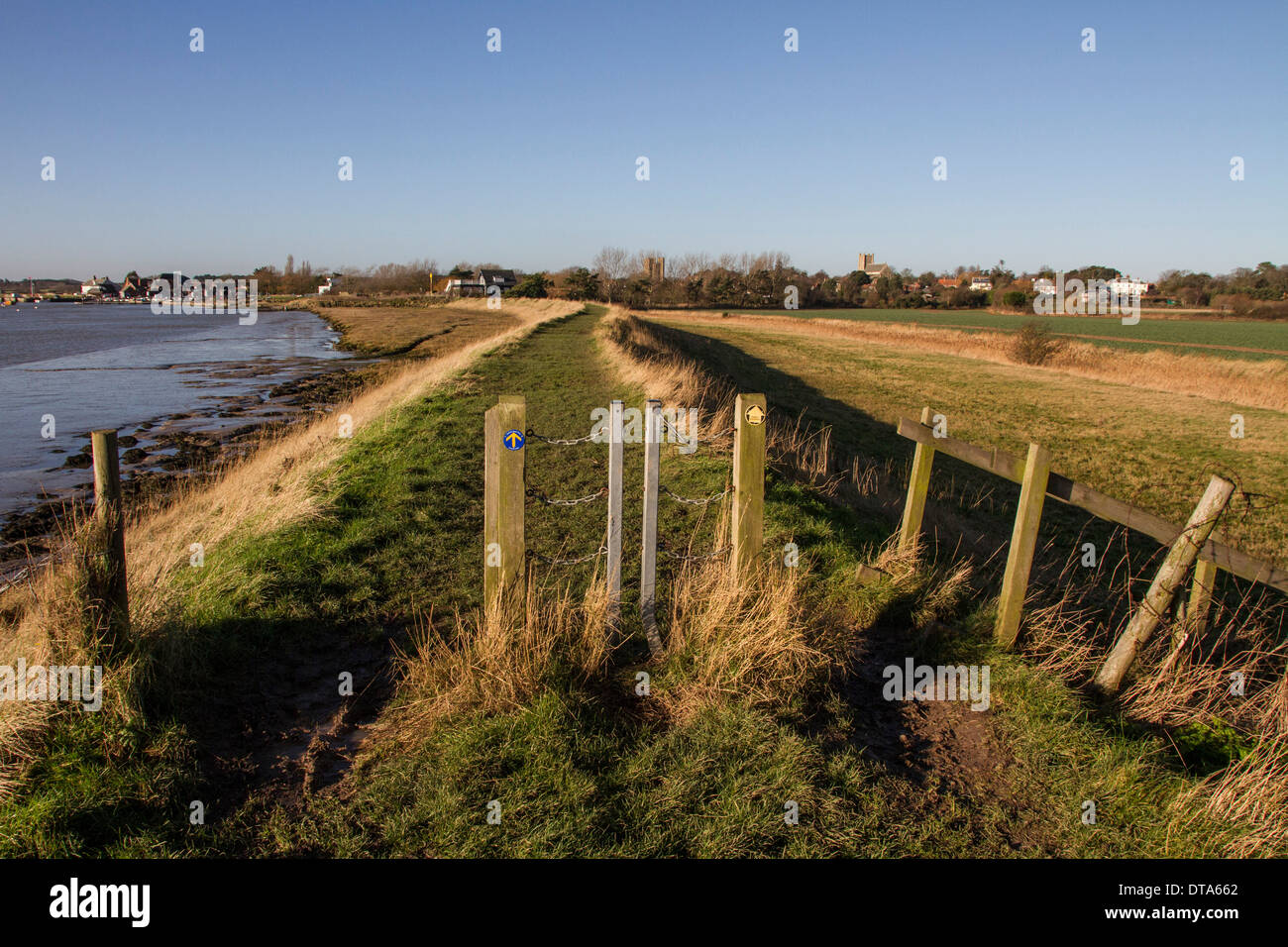 Metal swing gates on sea wall foot path, looking south to Orford, Suffolk. Stock Photo
