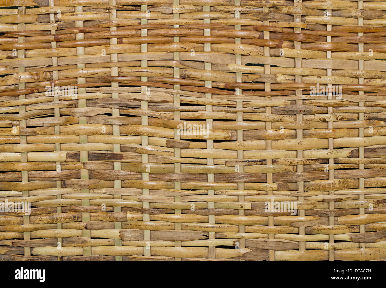 Woven wood wicker fence panel suitable for crafts, picnic or gardening background or wallpaper Stock Photo