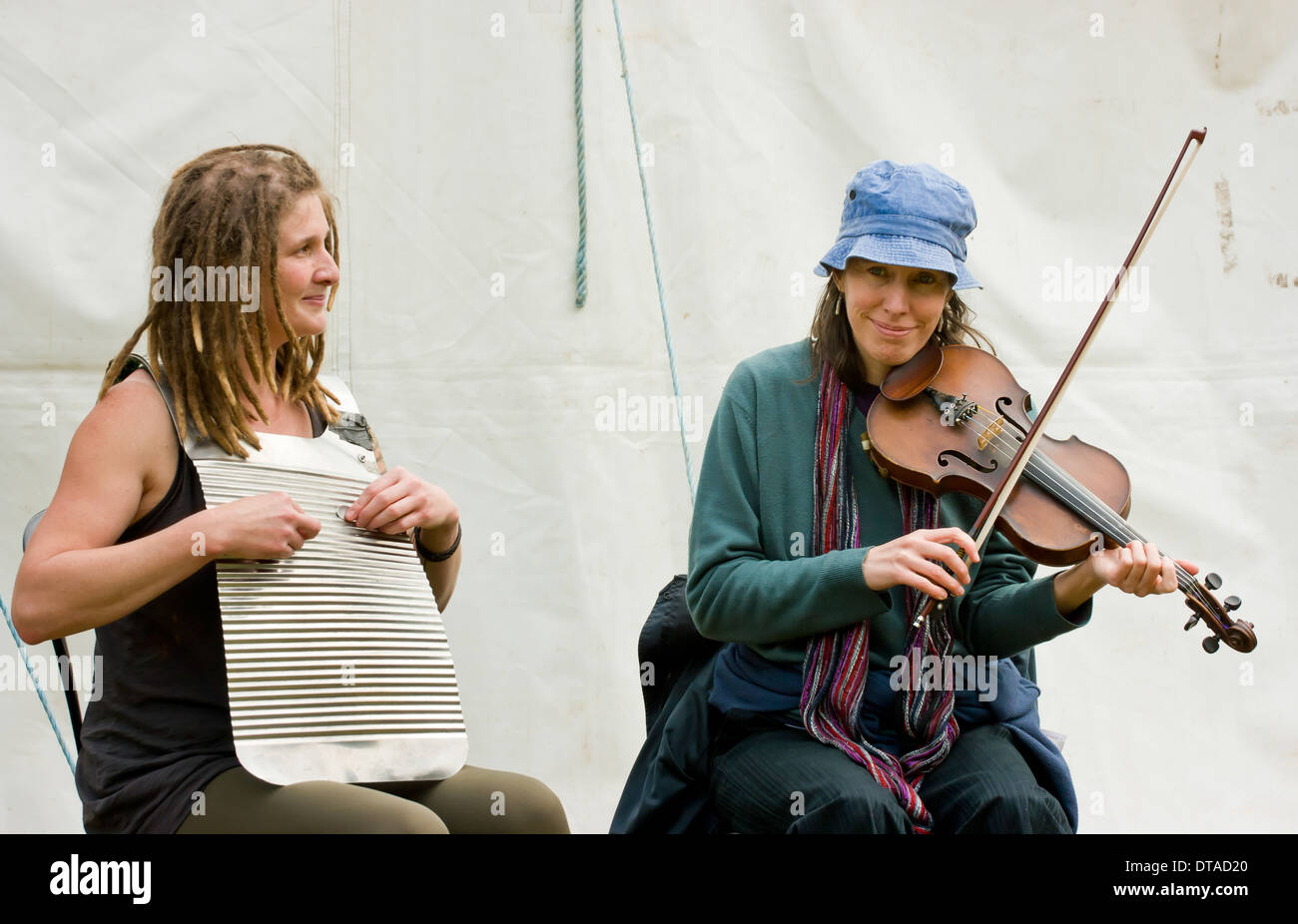 Young female musicians playing music at the annual East Midlands Etruria Canals Festival England Stock Photo