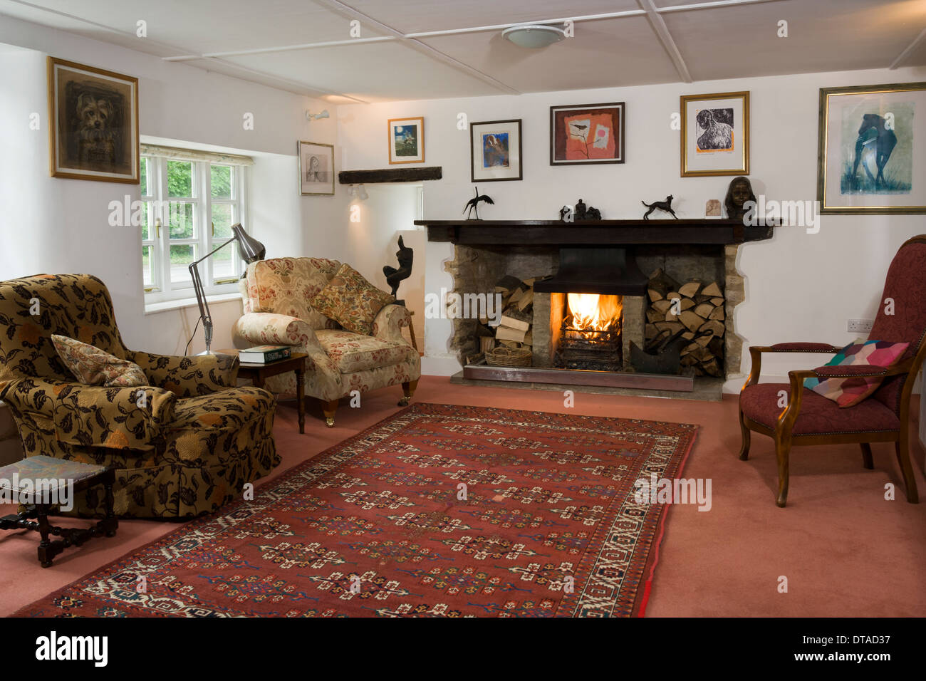 Traditional period home sitting room with fire. Stock Photo