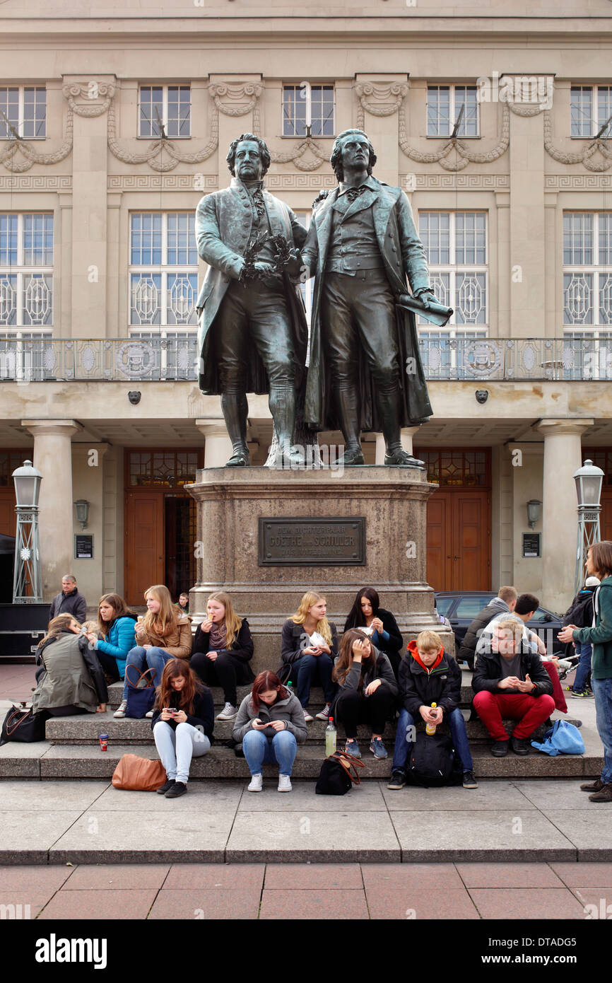 Weimar, Germany, a school class sitting under the Goethe- Schiller Monument Stock Photo