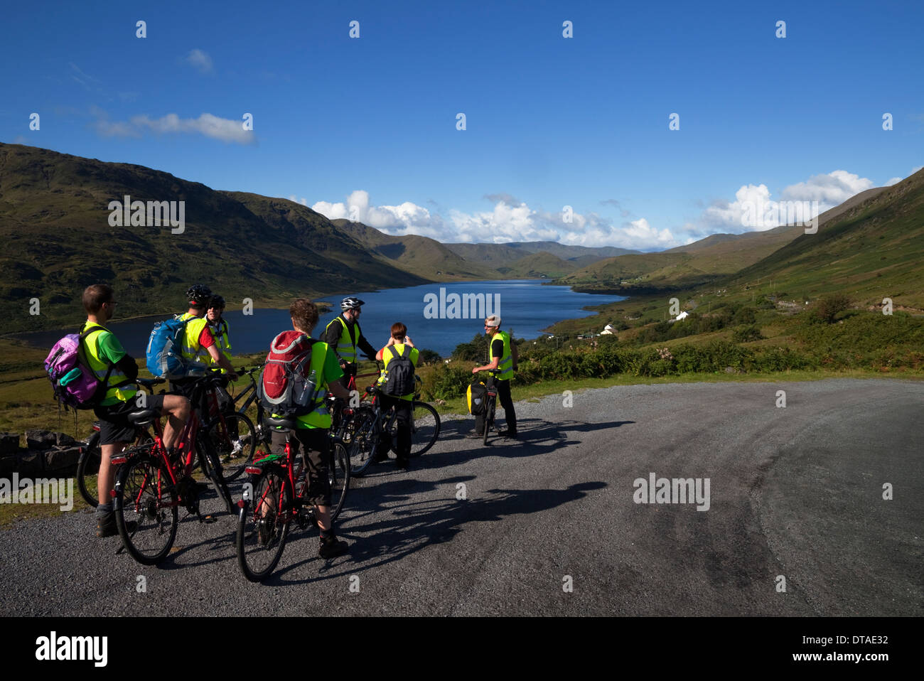 Cyclists above Lough Nafooey, Joyce's County, County Galway,  Ireland (from the County Mayo side of the border,) Stock Photo