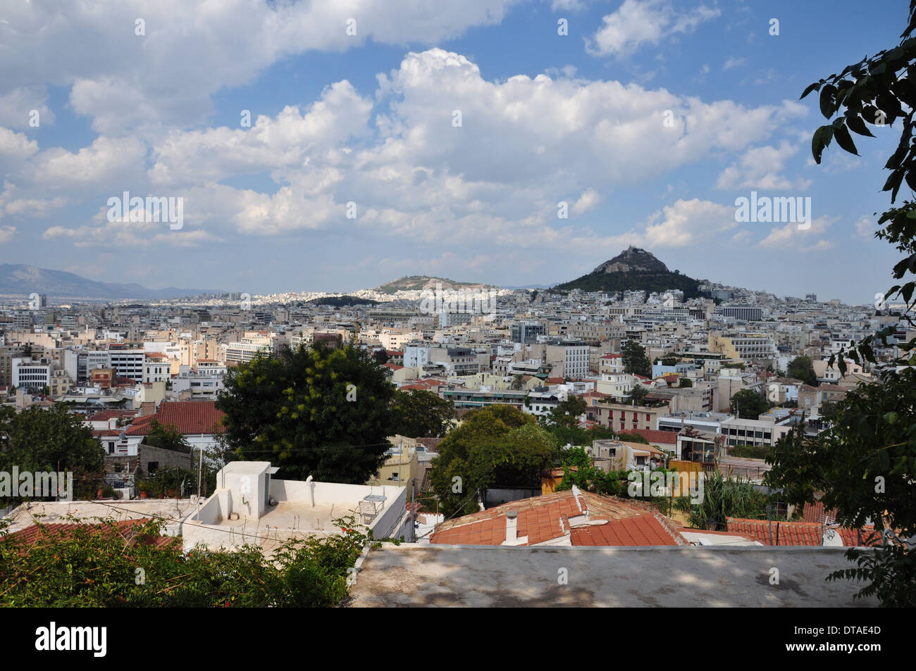View of the city of Athens Greece and Lycabettus hill as seen from Plaka. Stock Photo