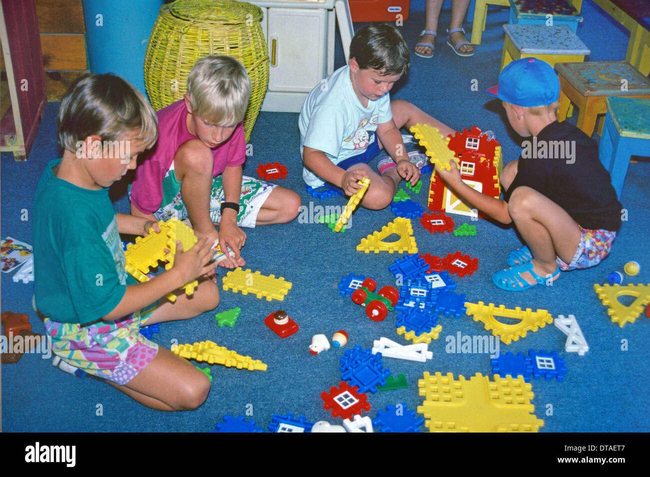 Boys Seven-to-Nine Years Old Playing or Using Construction Blocks, Lego or Building Model Toys in School Stock Photo