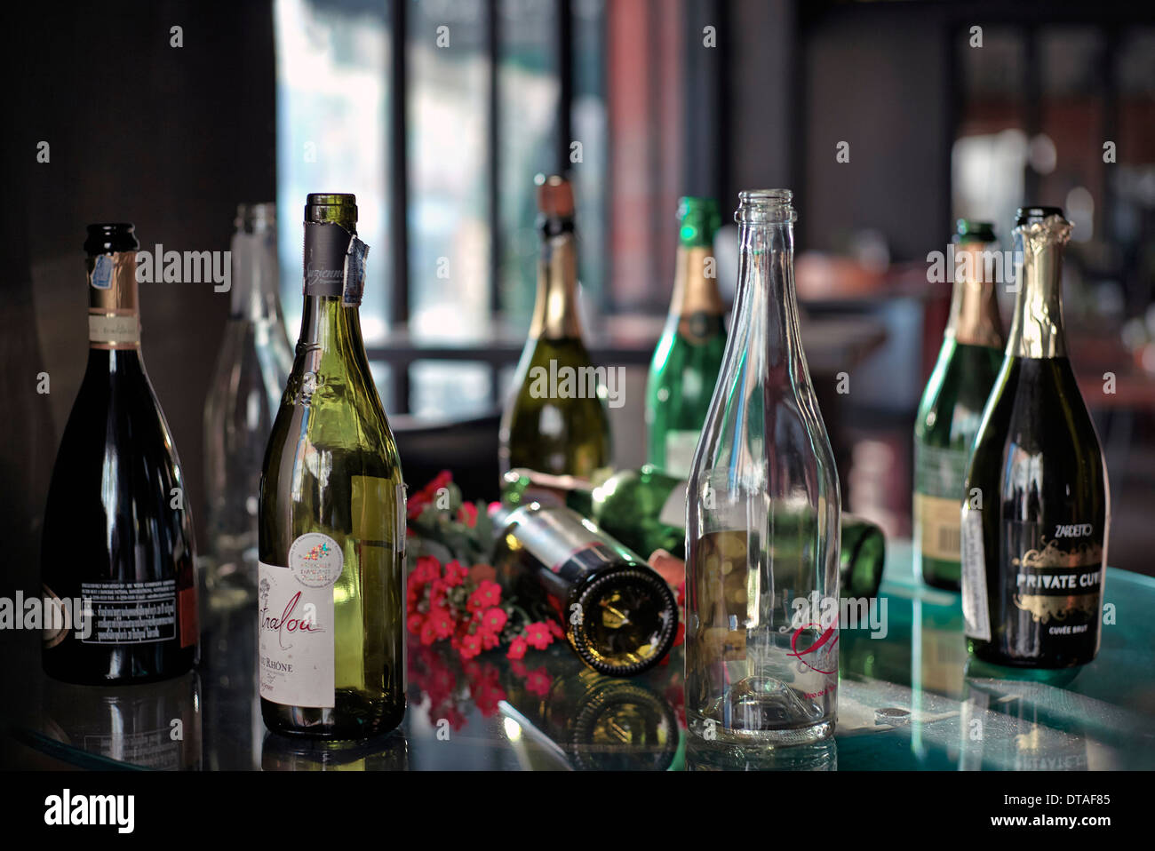 Wine bottles empty. The morning after the night before Stock Photo Alamy