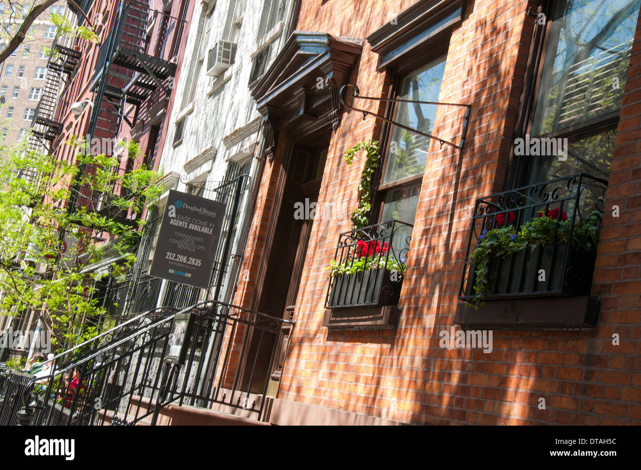 A quiet suburban street in Greenwich Village, Manhattan New York City, USA Stock Photo