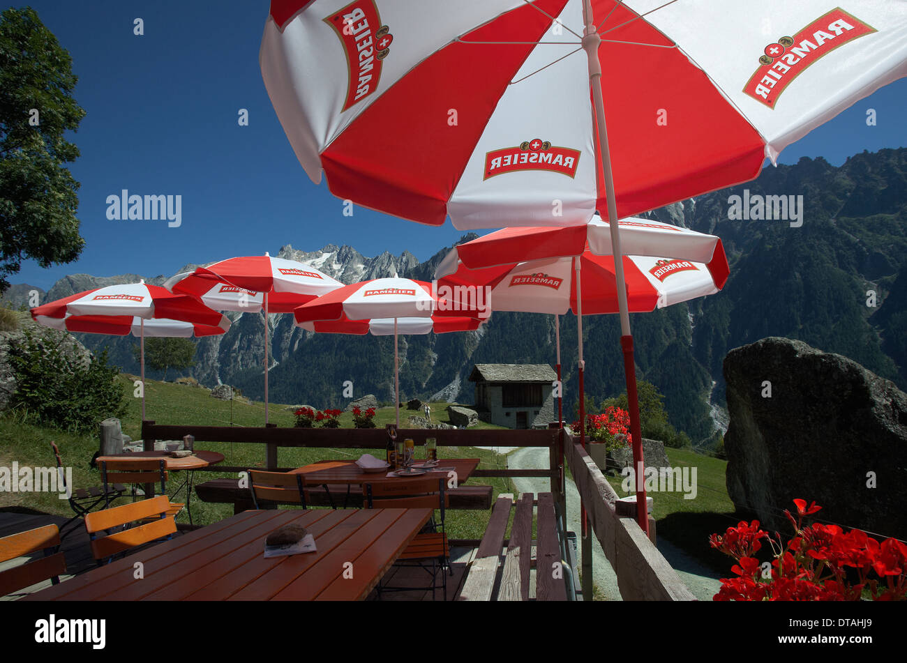 Durbegia, Switzerland, sun umbrellas on the small terrace of the Alp  Durbegia Stock Photo - Alamy